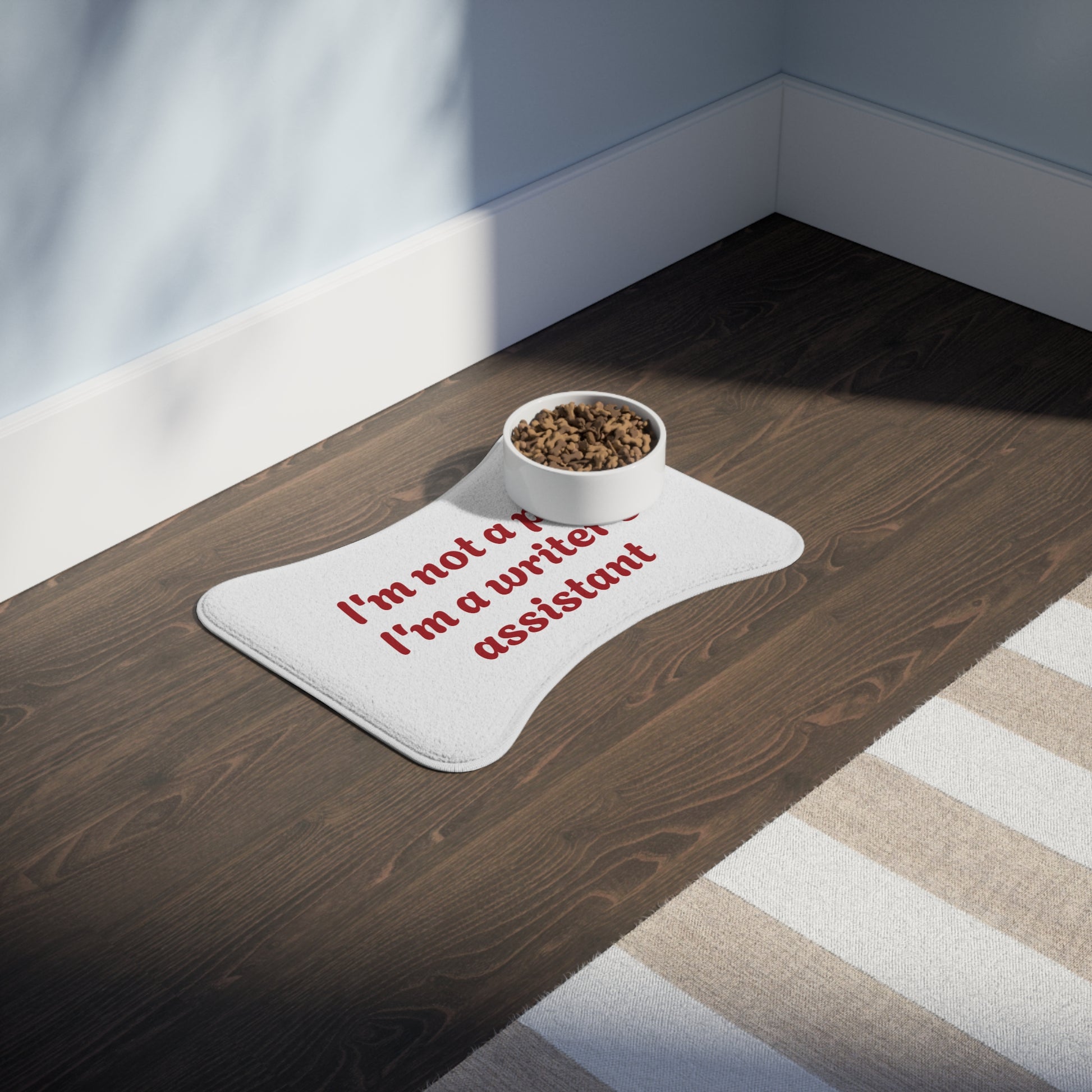 Funny Pet Feeding Mat - "I'm Not a Pet, I'm a Writer's Assistant" - The Dreamer's Bookshop.