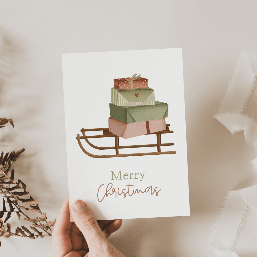 Tilda&Theo - Kerstkaart slee cadeaus - Kerstkaart - The Dreamer's Bookshop.