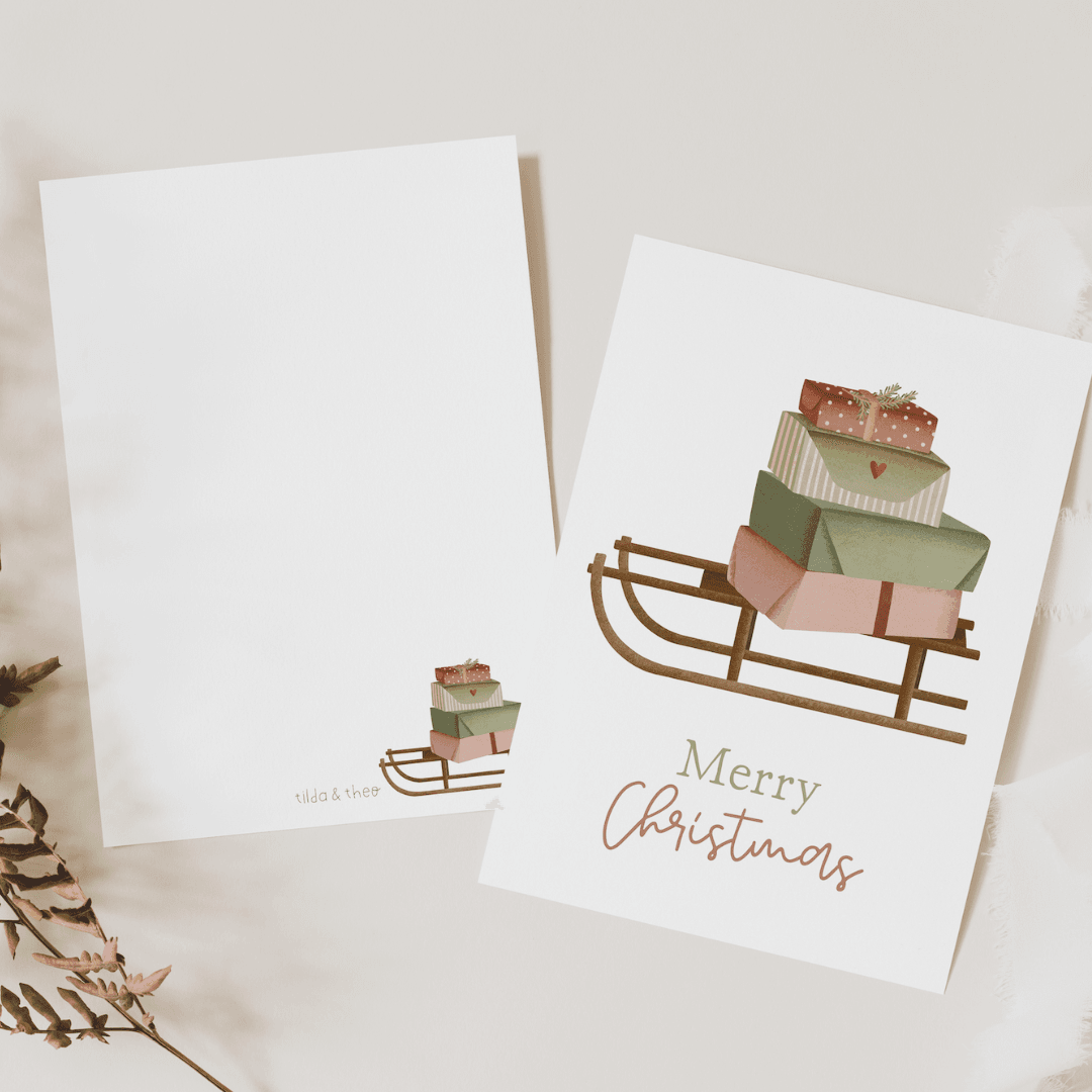 Tilda&Theo - Kerstkaart slee cadeaus - Kerstkaart - The Dreamer's Bookshop.